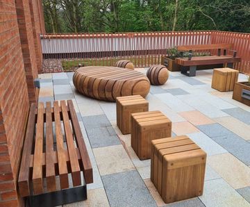 Timber seating and steel planters for Queen’s Business School, Belfast