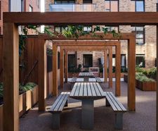 Timber pergolas, planters, picnic sets and seats for mixed-use development