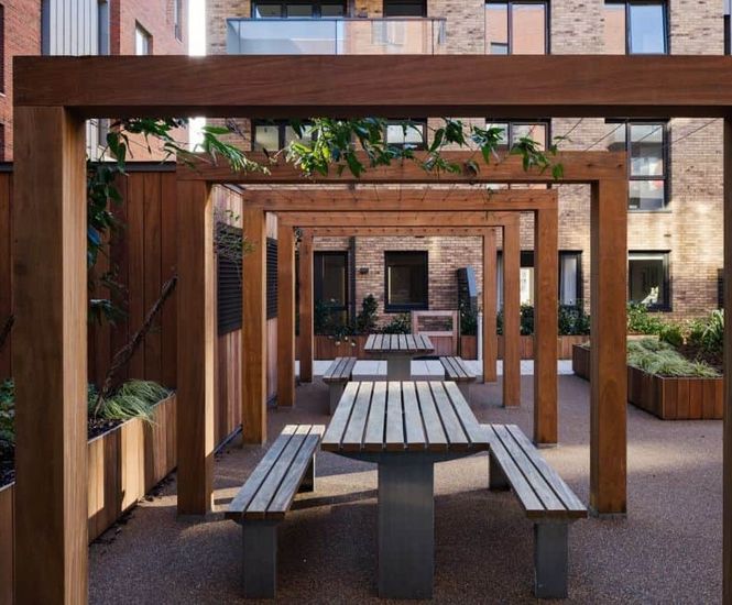 Timber pergolas, planters, picnic sets and seats for mixed-use development