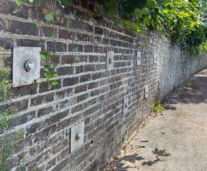 Percussion Driven Earth Anchors stabilise damaged retaining wall - Redhill