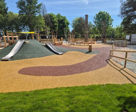 Resin bound rubber mulch safety surfacing for play areas