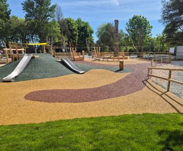 Resin bound rubber mulch safety surfacing for play areas