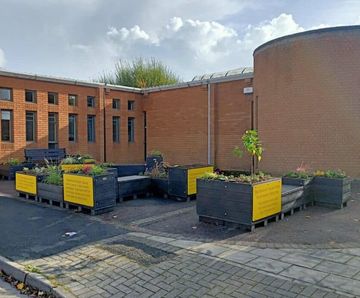 Recycled plastic parklet - modular urban seating and planter system
