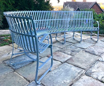 Curved hand-forged garden bench