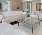 Tate buttoned fixed back sofa with wooden base