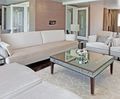 Tate buttoned fixed back sofa with wooden base