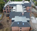 Thin Flat Duo concrete roof tiles installed on new care facility - on this page