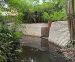 Above water concrete-filled bagwork used in riverbank scour repair