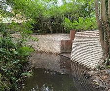 Above water concrete-filled bagwork used in riverbank scour repair