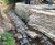 Pre-filled concrete bagwork repairs stream embankment - Dundee 0