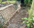 Pre-filled concrete bagwork repairs stream embankment - Dundee 1