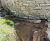 Pre-filled concrete bagwork repairs stream embankment - Dundee 9