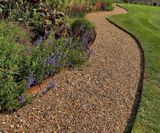 ProEdge corten steel lawn edging creates definition in countryside garden - on this page