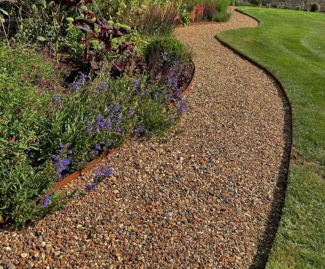 ProEdge corten steel lawn edging creates definition in countryside garden