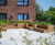 Raised timber planters with integrated seating for residential development 1