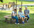 Sofiero 360° Curved Bench - bark brown wood park bench / tree seating 1