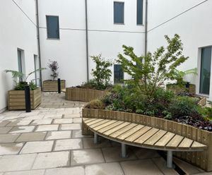 Raised planters and bench seating for hospital courtyards