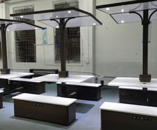Solar-powered picnic tables and benches with canopy shelter