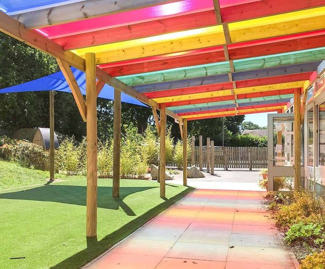 Timber pergola with coloured polycarbonate roof