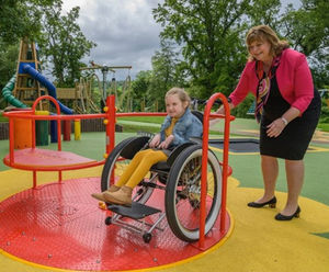 Swirl Inclusive Roundabout - wheelchair accessible playground spinner steel
