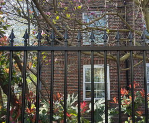 London community garden secured with vertical bar railings