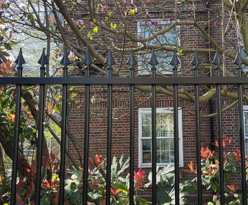 London community garden secured with vertical bar railings
