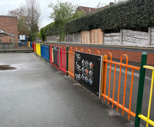 Bow top anti-trap fencing in bright colours for Stockport primary school