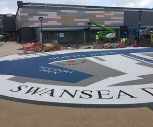 Resin bound wayfinding graphic with historical message