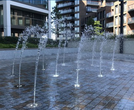 Water jets feature for riverside apartments plaza