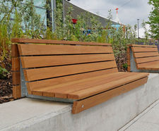 Retrofit wall-top seating for designer retail outlet