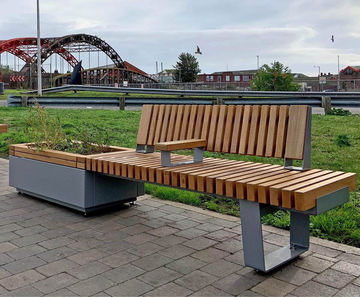 Planters and integrated seats enhance station forecourt