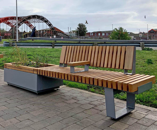 Planters and integrated seats enhance station forecourt