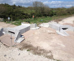 Culvert header beams and wingwalls