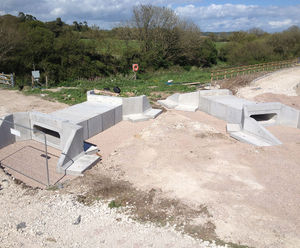 Culvert header beams and wingwalls