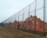 Ball-stop fencing protects housing development