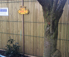 Security-rated fencing for police community safety house