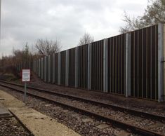 Absorptive barrier reduces rail noise for residents