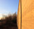 Acoustic fencing reduces road noise for housing complex 3