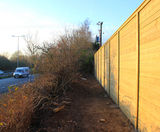 Acoustic fencing reduces road noise for housing complex - on this page
