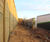 Acoustic fencing reduces road noise for housing complex 4