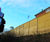 Acoustic fencing reduces road noise for housing complex 5