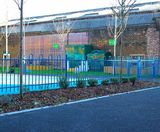 Anti-trap bow top fencing protects school playground - on this page