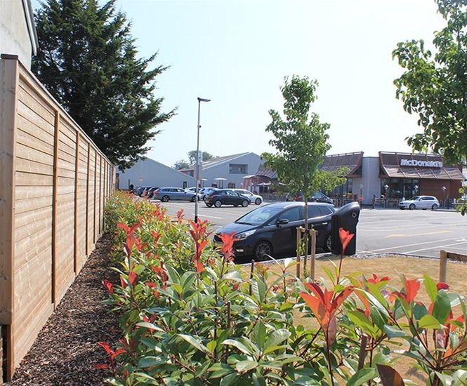 Acoustic fencing noise barrier for fast food restaurant