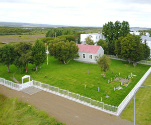 Bow top fencing provides demarcation at Icelandic church