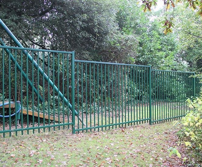 Vertical bar fencing protects special needs school