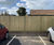 Timber fence panels create boundary at supermarket 1