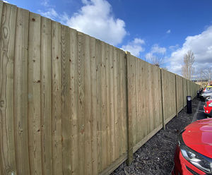 Timber fence panels create boundary at supermarket