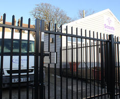 Vertical bar perimeter fencing for Scout facility