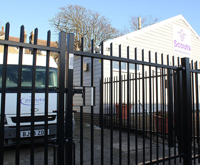 Vertical bar perimeter fencing for Scout facility