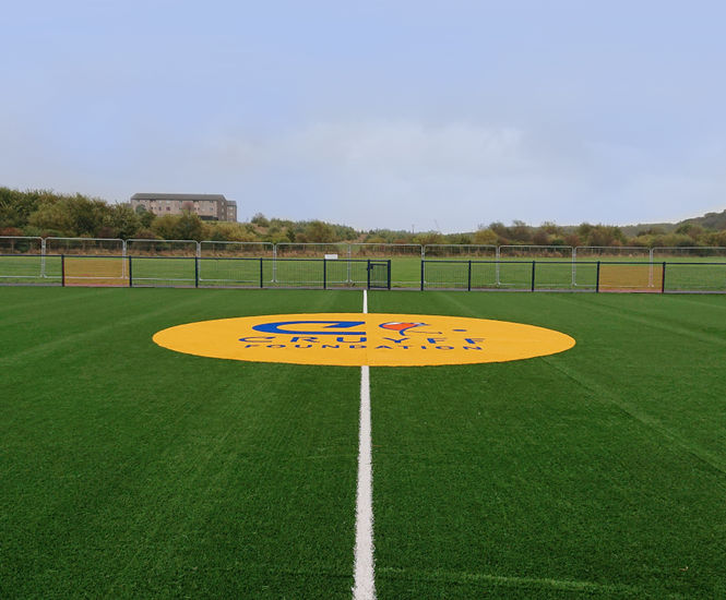 Artificial grass sports surfacing for community facility